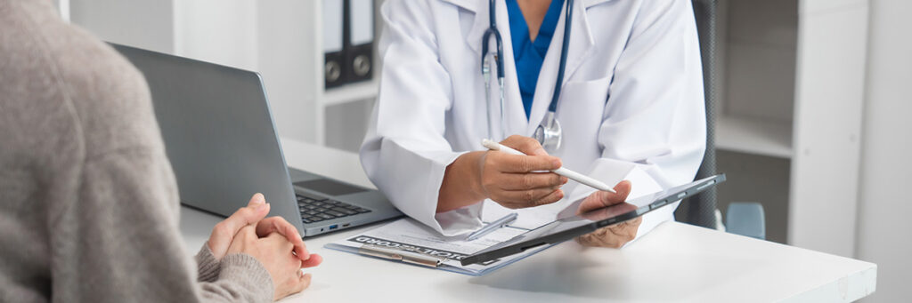 Amputation Compensation Claims – How Much Compensation Am I Eligible to Claim? Picture of a medical professional explaining the amputation process to a patient.